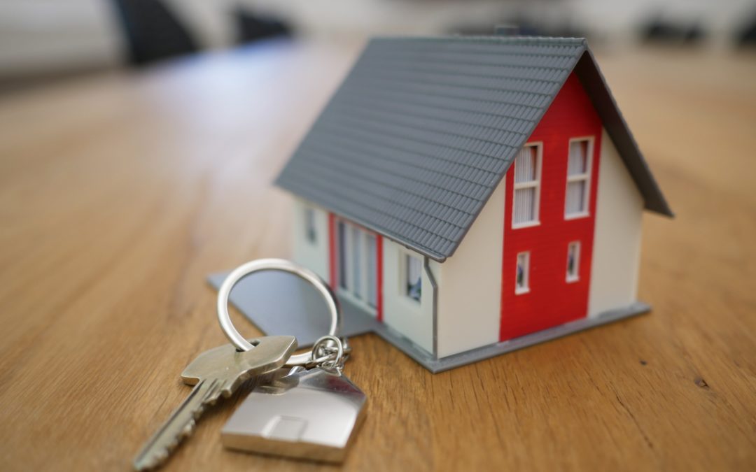 A model house alongside a set of keys